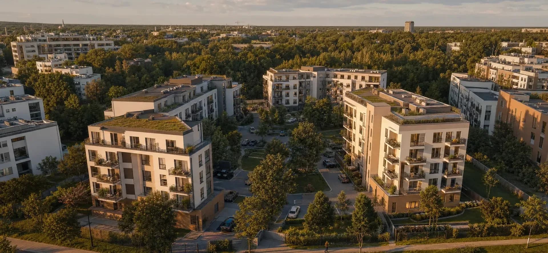 Aerial render of a residential development with landscaping and access roads