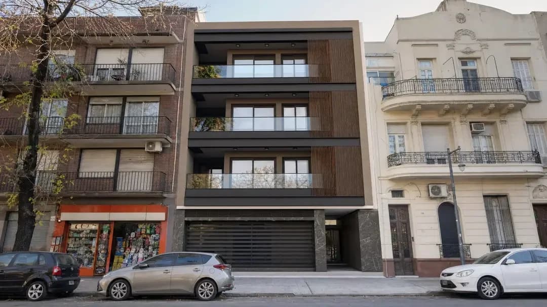 Photomontage — finished residential building blended into a real street photo, Elegant Render
